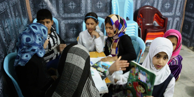 Girls study at an orphanage in Baghdad, Iraq. Photo / AP