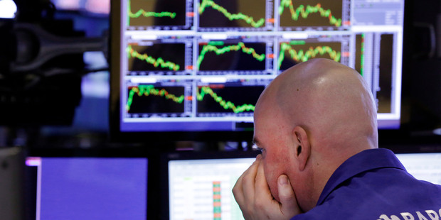 A specialist on the floor of the New York Stock Exchange. High frequency trading of shares is attracting the attention of authorities - does it count as inside trading? File Photo / AP