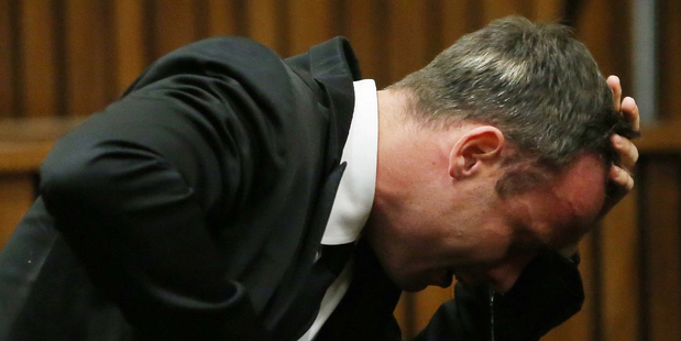 Oscar Pistorius weeps as he listens to evidence by a pathologist in court on April 7, 2014. Photo / AP