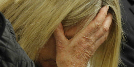 June Steenkamp, mother of the late Reeva Steenkamp, reacts as she listens as Oscar Pistorius' testimony at his murder trial. Photo / AP