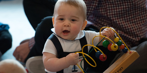 Prince George plays with the toys during a Plunket nurse and parents group visit at Government House in Wellington. Photo / Marty Melville