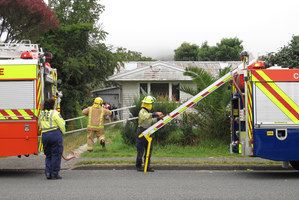 Firefighters at the scene of a suspicious fire in Moerewa this morning.