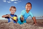 Blake Rodden (left), 3, and Maui Marino, 5, enjoy the sunshine at Omanu Beach yesterday. Photo/Andrew Warner Blake Rodden (left), 3, and Maui Marino, 5, enjoy the sunshine at Omanu Beach yesterday. Photo/Andrew Warner