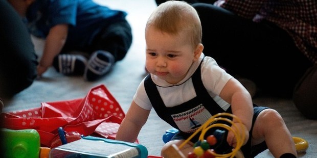 Prince George was dressed in navy smocked dungarees with a sailboat design. Photo / AFP