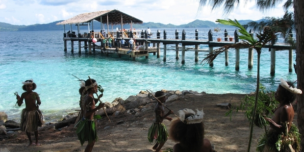 Dancers welcome visitors to the Doini Island Resort.
