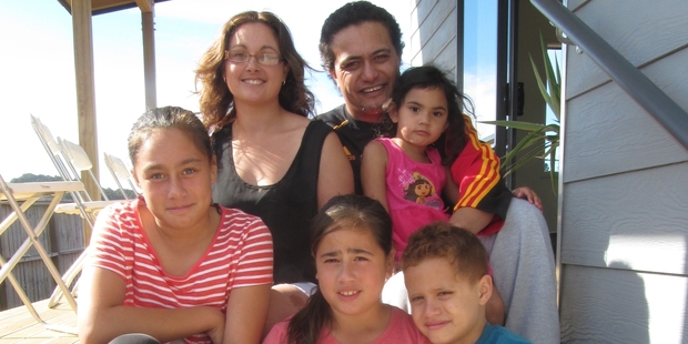 Kirsty Slack and Frank Vlamings (back left to right) with their blended family including Evolet Vlamings, 3, back right, Jada Slack, 11, front left, Mya Slack, 9, front centre, and Detroit Vlamings, 7, front right. Two-year-old Elexus Rupena-Tuoro is not pictured as he was taking an afternoon nap. Photo/Hannah Norton