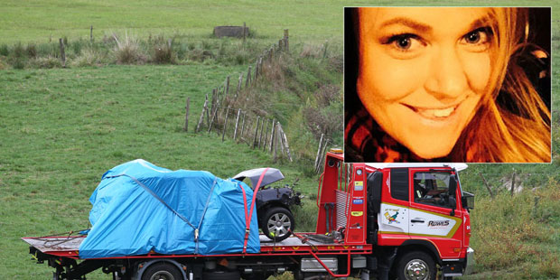 A towe truck removes the wreck of a car belonging to missing woman Kelly Ann Sinclair, found crashed down a bank in Whakamarama. Photo/John Borren