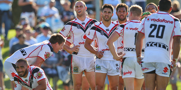 Warriors players look on during their 37-6 defeat to the Sharks. Photo / Getty Images