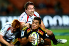 HAMILTON, NEW ZEALAND - APRIL 12: Augustine Pulu of the Chiefs is tackled by Nic Stirzaker of the Rebels during the round nine Super Rugby match between the Chiefs and the Rebels at Waikato Stadium o HAMILTON, NEW ZEALAND - APRIL 12: Augustine Pulu of the Chiefs is tackled by Nic Stirzaker of the Rebels during the round nine Super Rugby match between the Chiefs and the Rebels at Waikato Stadium o
