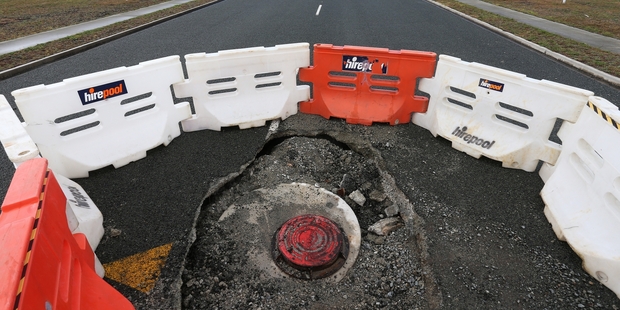 Manholes have collapsed and the road closed at the new Marsden City development. Photo/File