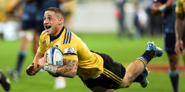 TJ Perenara scores for the Hurricanes in their Super Rugby win over the Blues. Photo / Getty Images