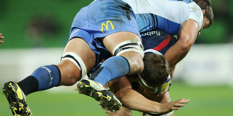 Wilhelm Steenkamp of the Force tackles Luke Jones of the Rebels during their Super Rugby encounter. Photo / Getty Images