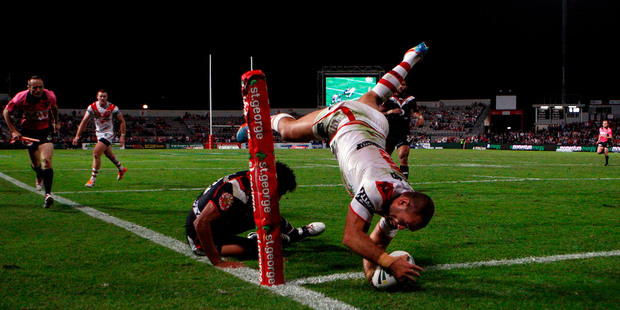 Jason Nightingale of the Dragons scores a try in the corner against the Warriors. Photo / Getty Images