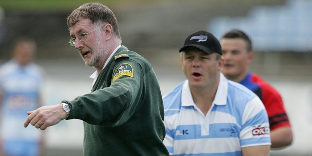 Alex Smits (in striped shirt), Rugby League Northland general manager, helps an injured representative player from the field. Smits says if a suspected serious injured has occurred, call for help. Photo/Ron Burgin