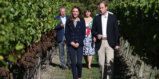 Prince William and Catherine stroll among the vines during their well-publicised visit to Amisfield Winery. Photo / AFP