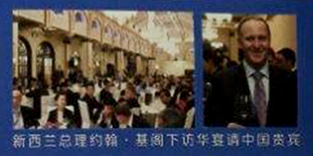 John Key's picture in the Oravida advertisement in the Chinese in-flight magazine.