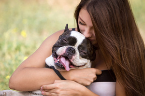 Giving that pooch a cuddle will help unlock joy in your life. Photo / Thinkstock