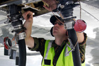 CPL Payne conducts a refuel as part of the maintenance team for the RNZAF P-3K2 Orion searching for MH370. CPL Payne conducts a refuel as part of the maintenance team for the RNZAF P-3K2 Orion searching for MH370.