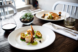 The bacon and eggs starter dish and the roast chicken breast, on the menu at Loop. Photo / Babiche Martens.