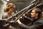 Theo James as Four and Shailene Woodley as Tris strike up a bond in Divergent. Theo James as Four and Shailene Woodley as Tris strike up a bond in Divergent.
