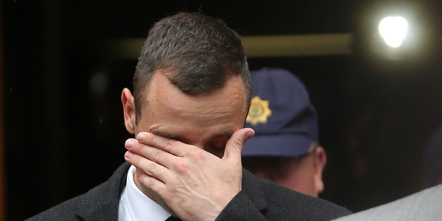 Oscar Pistorius leaves the high court in Pretoria, South Africa. Photo / AP