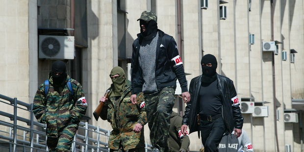 Kiev authorities say tens of thousands of Russian troops are stationed near the border with Ukraine and fear that unrest in the east will be used as a pretext for a military incursion. Photo / AP