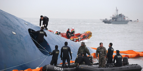 South Korean rescue team members search for passengers aboard a ferry sinking off South Korea's southern coast, in the water off the southern coast near Jindo, south of Seoul. Photo / AP
