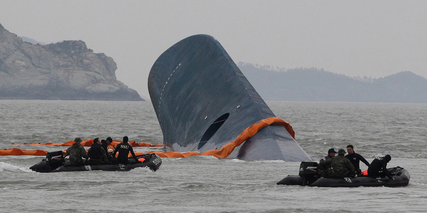 Rescuers have worked through the night trying to reach 290 people still trapped in the sunken ferry. Photo / AP