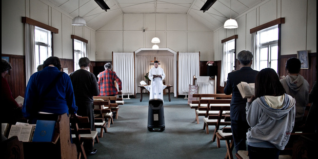 Reverend Uesifili Unasa conducts a service at the Beach Haven Methodist Church before its closure. Photo / Neville Marriner