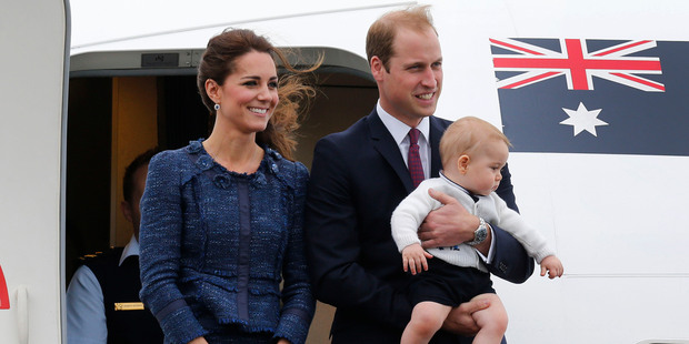 The Duke and Duchess of Cambridge, with Prince George, as they board their jet departing Wellington. She is wearing a skirt suit by New Zealand-born designer Rebecca Taylor. Picture / Mark Mitchell