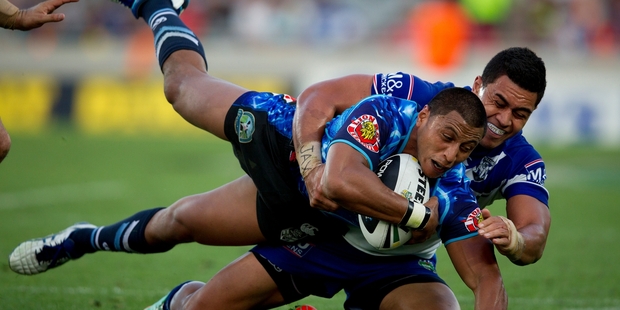 Dominique Peyroux is tackled during the tense match against the Bulldogs. Photo / Sarah Ivey
