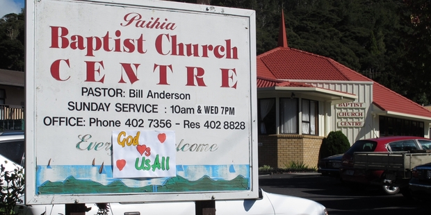 Brightly coloured posters were only sign of protest at Paihia's Baptist Church on Sunday. Photo/Peter de Graaf