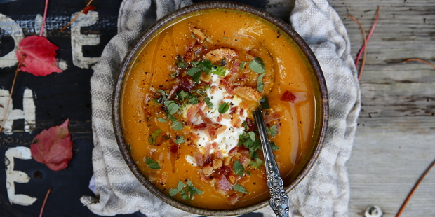 Pumpkin soup topped with oregano, natural yoghurt and bacon crumbs. Photo / Eleanor Ozich