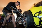 Driver Shane van Gisbergen proves he can change a tyre on his Holden at Auckland's Aotea Square. Photo / Brett Phibbs Driver Shane van Gisbergen proves he can change a tyre on his Holden at Auckland's Aotea Square. Photo / Brett Phibbs