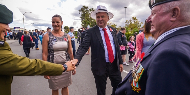 Shane Jones greets servicemen at the Manurewa Anzac Day parade, accompanied by his partner Dot Pumipi. Photo / Jason Dorday