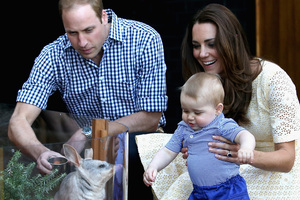 Catherine, Duchess of Cambridge holds Prince George of Cambridge as Prince William, Duke of Cambridge looks on whilst meeting a Bilby called George at Taronga Zoo. Photo / Getty Images