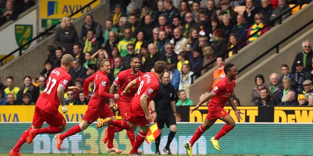 Liverpool's Raheem Sterling (right) celebrates scoring the opening goal against Norwich City at Carrow Road yesterday. Photo / AP