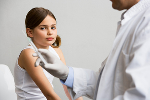 Girl and doctor with injection