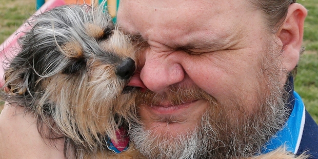 Jerry Starr refused to abandon his dog Tobi during the tornado and stayed outside a shelter with his pet. Photo / AP