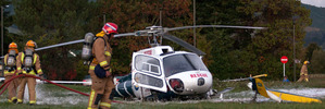 Emergency services at the scene near Taupo hospital yesterday after a Bay Trust rescue helicopter crashed. Two people received minor injuries. JESSICA KATE WILLIAMSON