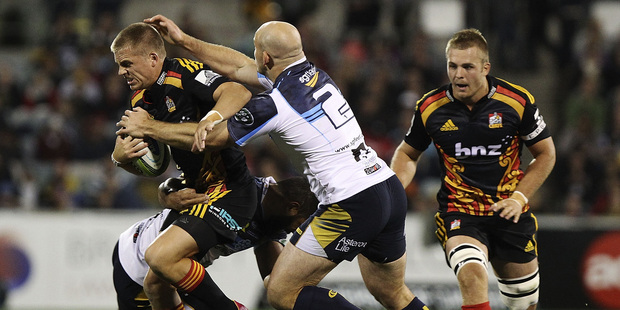 CANBERRA, AUSTRALIA - APRIL 25: Gareth Anscombe of the Chiefs is tackled during the round 11 Super Rugby match between the Brumbies and the Chiefs at Canberra Stadium. Photo / Getty.
