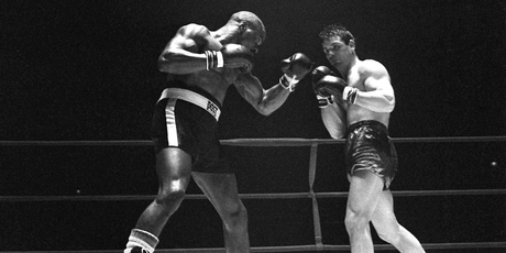 Rubin "Hurricane" Carter, left, knocks out Italian boxer Fabio Bettini in the 10th and last round of their fight at the Falais Des Sports in Paris. Photo / AP