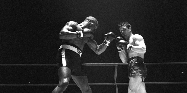 Rubin "Hurricane" Carter, left, knocks out Italian boxer Fabio Bettini in the 10th and last round of their fight at the Falais Des Sports in Paris. Photo / AP