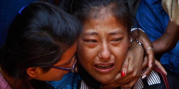 A relative of one of the Nepalese climbers killed in an avalanche on Mount Everest. Photo / AP
