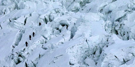 Mountaineers pass through the treacherous Khumbu Icefall on their way to Mount Everest. Photo / AP