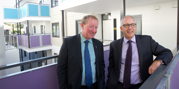 Housing Minister Nick Smith, left, said he was "open to some degree of discounting" to achieve his target. Photo / Richard Robinson
