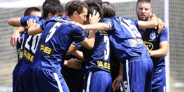 Auckland City players celebrate against Waitakere United earlier this season. Photo / Shane Wenzlick