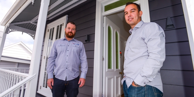 Justin Boyes (left), marketing manager for HRV and Ben Harvey-lovell, marketing manager for Mercury Energy on the deck of a house renovation project. Photo / Jason Dorday