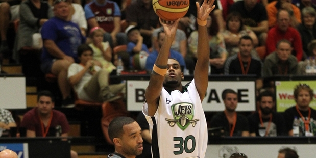 Jets guard Alonzo Burton lines up a shot but Hawks counterpart Everard Bartlett walked off with a game-high 21 points in yesterday's NBL match in Napier. Photo/Duncan Brown
