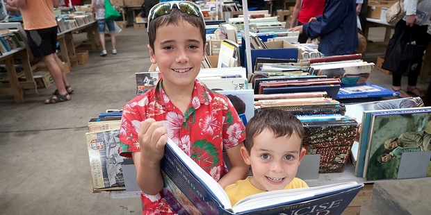 Ruben, 9, and Marcus, 5, Barrow scoured the tables of books for bargains at the Tauranga Rotary Club's 27th Annual Easter Book Sale. Photo/Andrew Warner